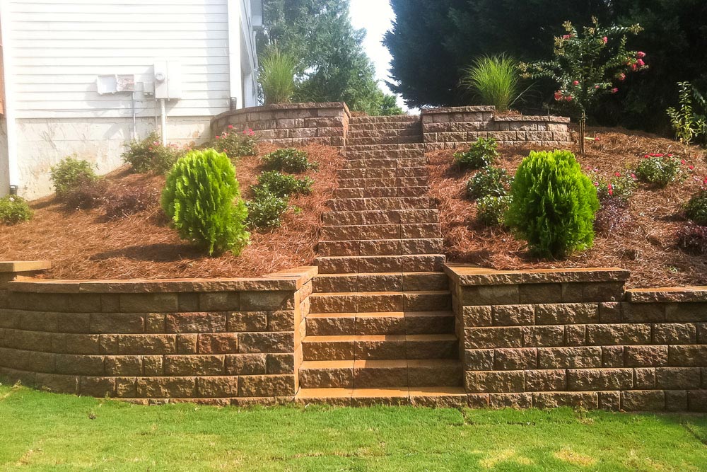 Retaining wall and stairs made of pavers.